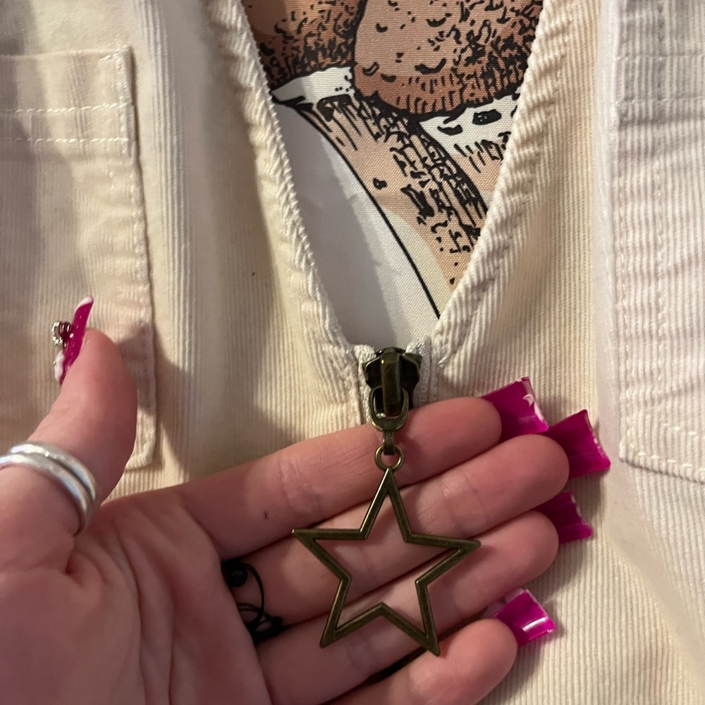 Halter shorts jumpsuit with star keychain zip up in the front. - Picture 5 of 7